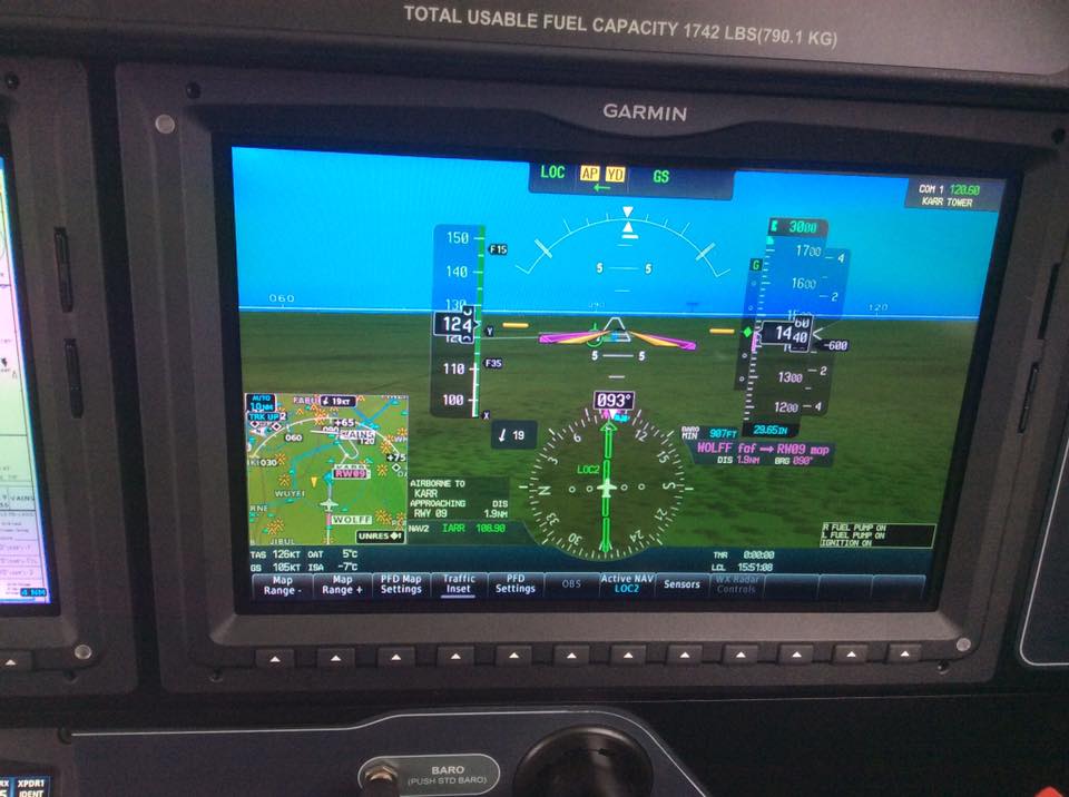 A picture of the screen in an airplane.