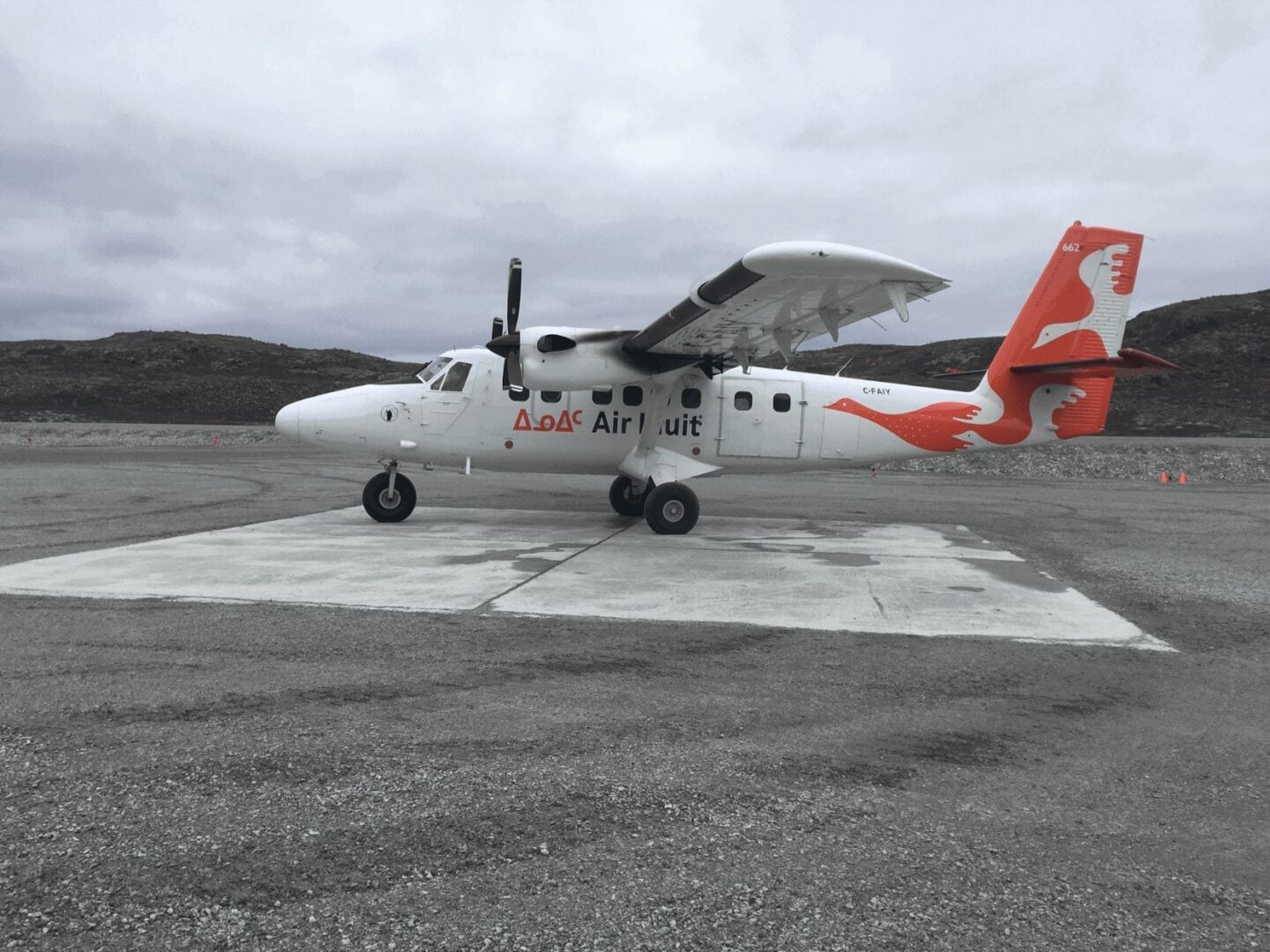 A small plane sitting on top of an airport runway.